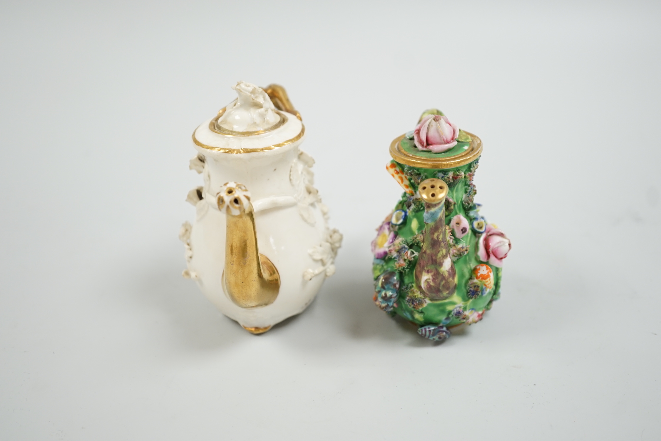 Toy porcelain. A Rockingham flower encrusted rosewater sprinkler and an English porcelain flower encrusted rosewater sprinkler, probably Spode, c.1830, the former with gilt model no. ‘C1’, tallest 10.5cm high